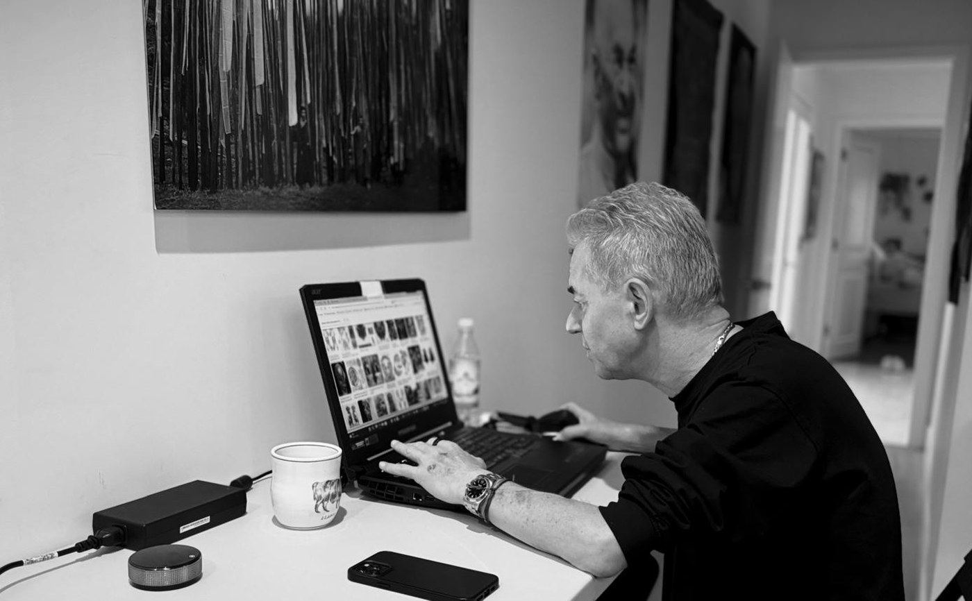 Johannes Maierhofer doing focused analysis work on a laptop